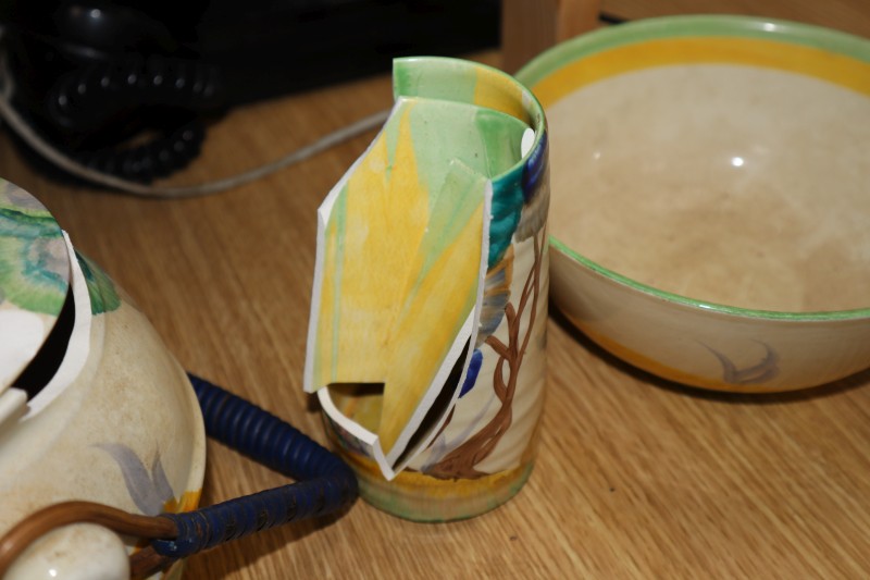 Three Clarice Cliff pots and another vase (a.f.)